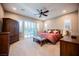 Comfortable main bedroom with neutral carpet and a ceiling fan at 10507 Bryn Haven Ave, Las Vegas, NV 89135