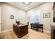 Charming home office with a large desk, hardwood floors, and bright window, perfect for remote work at 10507 Bryn Haven Ave, Las Vegas, NV 89135