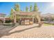 Stunning outdoor kitchen with built-in grill under a pergola, set in a spacious backyard with pavers at 10507 Bryn Haven Ave, Las Vegas, NV 89135