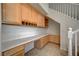 Hallway desk nook, featuring built-in cabinets and desk space next to a stairway at 10530 Eagle Nest St, Las Vegas, NV 89141