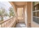 Cozy balcony with natural light and an archway showcasing a view of greenery at 10550 W Alexander Rd # 2057, Las Vegas, NV 89129