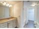 Stylish bathroom featuring a granite countertop, modern vanity, and a separate shower at 10550 W Alexander Rd # 2057, Las Vegas, NV 89129