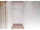 A walk-in closet with wood flooring and metal shelving provides a stylish and functional space at 10550 W Alexander Rd # 2057, Las Vegas, NV 89129