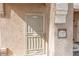 A secure front door with metal screen welcomes you home, accented by a decorative address plaque at 10550 W Alexander Rd # 2057, Las Vegas, NV 89129