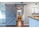 Modern interior showcasing a barn door, hardwood floors, and stylish accents at 10550 W Alexander Rd # 2057, Las Vegas, NV 89129
