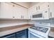 Bright kitchen with white subway tile backsplash, granite countertops, and modern appliances at 10550 W Alexander Rd # 2057, Las Vegas, NV 89129