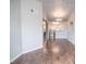 Open-concept living area with hardwood floors, leading to a modern kitchen at 10550 W Alexander Rd # 2057, Las Vegas, NV 89129