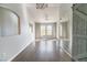 Bright living room featuring hardwood floors, large windows, and modern ceiling fans at 10550 W Alexander Rd # 2057, Las Vegas, NV 89129