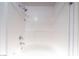 Clean bathroom featuring a tub and shower with clean white tiles at 10550 W Alexander Rd # 2057, Las Vegas, NV 89129