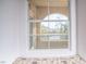 Window view from the bedroom overlooking a charming balcony and scenic landscape at 10550 W Alexander Rd # 2057, Las Vegas, NV 89129