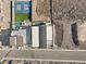 An aerial view shows a modern home with a pool, basketball court, desert landscaping, and mountain views at 1057 Giovanni Ln, Henderson, NV 89012
