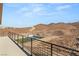 Spacious balcony with mountain and neighborhood views, featuring a black metal railing at 1057 Giovanni Ln, Henderson, NV 89012