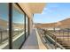 Home exterior with a balcony overlooking desert landscape and outdoor amenities at 1057 Giovanni Ln, Henderson, NV 89012