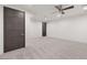 Bright bedroom with carpet, ceiling fan, and a modern door at 1057 Giovanni Ln, Henderson, NV 89012