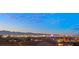 Dazzling city skyline view at dusk, showcasing iconic landmarks and vibrant city lights at 1057 Giovanni Ln, Henderson, NV 89012