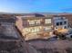 Modern two-story home featuring balconies and a desert landscaped yard at 1057 Giovanni Ln, Henderson, NV 89012