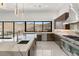 Modern kitchen with a large island, stainless steel appliances, and a stunning outdoor view at 1057 Giovanni Ln, Henderson, NV 89012