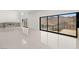 Spacious living room featuring a modern fireplace and a large window with scenic views at 1057 Giovanni Ln, Henderson, NV 89012