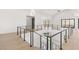 Second floor loft area with metal railings and an open view of downstairs at 1057 Giovanni Ln, Henderson, NV 89012