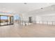 Bright loft featuring wood flooring, natural light, modern lighting, and an open layout, ideal for flexible living at 1057 Giovanni Ln, Henderson, NV 89012