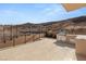 Outdoor kitchen and patio with stainless steel appliances, countertop, and desert views at 1057 Giovanni Ln, Henderson, NV 89012
