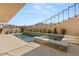 Beautiful outdoor pool and spa with tiled accents and manicured landscaping at 1057 Giovanni Ln, Henderson, NV 89012