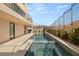 Luxurious backyard pool area with modern design and manicured landscaping at 1057 Giovanni Ln, Henderson, NV 89012
