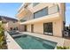 Rear elevation with modern pool, spa, patio, and balconies on multiple levels at 1057 Giovanni Ln, Henderson, NV 89012