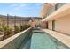 Inviting pool and spa area with modern home exterior and desert landscape at 1057 Giovanni Ln, Henderson, NV 89012