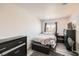 Bright bedroom featuring a comfortable bed, dark wood furnishings, and modern decor at 1228 Mews Ln, Las Vegas, NV 89101
