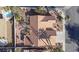 Aerial view of the house and roof surrounded by desert landscaping and swimming pool at 1270 Del Lilly Ln, Las Vegas, NV 89123