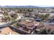 Aerial view of residential neighborhood featuring desert landscaping, tile roofs and mature palm trees at 1270 Del Lilly Ln, Las Vegas, NV 89123