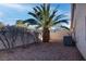 Low maintenance backyard with desert landscaping, mature trees, block fence and air conditioning unit at 1270 Del Lilly Ln, Las Vegas, NV 89123