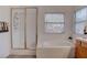 Bright bathroom featuring soaking tub, glass shower and neutral finishes at 1270 Del Lilly Ln, Las Vegas, NV 89123