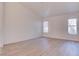 Spacious bedroom with light, neutral-toned walls, and natural light streaming through the large windows at 1270 Del Lilly Ln, Las Vegas, NV 89123