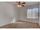 Bright bedroom featuring a ceiling fan, neutral paint, and large window at 1270 Del Lilly Ln, Las Vegas, NV 89123