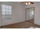 Bedroom featuring a mirrored closet, natural light, and neutral carpeting at 1270 Del Lilly Ln, Las Vegas, NV 89123
