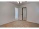 Neutral bedroom with mirrored closet doors and light-colored carpeting at 1270 Del Lilly Ln, Las Vegas, NV 89123