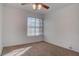 Bedroom featuring a window, ceiling fan, neutral paint, and carpeted floors at 1270 Del Lilly Ln, Las Vegas, NV 89123