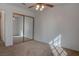 Bedroom features a ceiling fan, mirrored closet, neutral walls, and carpeted floors at 1270 Del Lilly Ln, Las Vegas, NV 89123