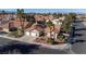 Charming single-story home with a two-car garage, desert landscaping, and a red tile roof in a quiet neighborhood at 1270 Del Lilly Ln, Las Vegas, NV 89123