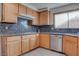 Bright kitchen featuring wood cabinetry, stainless steel appliances, and granite countertops at 1270 Del Lilly Ln, Las Vegas, NV 89123