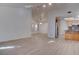 Bright open-concept living space with wood flooring, vaulted ceilings, and natural light at 1270 Del Lilly Ln, Las Vegas, NV 89123