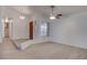 Open-concept living room with fresh paint, new floors, a step-up entry way and lots of natural light at 1270 Del Lilly Ln, Las Vegas, NV 89123