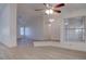 Open-concept living room with fresh paint, new floors, a step-up entry way and lots of natural light at 1270 Del Lilly Ln, Las Vegas, NV 89123