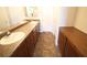 Bathroom featuring dual sinks, ample counter space, and storage at 1286 Horizon Village Ave, Las Vegas, NV 89183