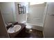 Bathroom with a single sink, toilet, mirror, shower, and tile floors at 1286 Horizon Village Ave, Las Vegas, NV 89183