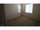 Bedroom with neutral carpet and two bright windows at 1286 Horizon Village Ave, Las Vegas, NV 89183