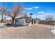 Charming single-story home featuring gravel landscaping and black trim at 1401 E Clark Ave, Las Vegas, NV 89101