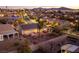 This aerial view shows the house and its neighborhood at sunset at 1657 Hartley Ave, Henderson, NV 89052